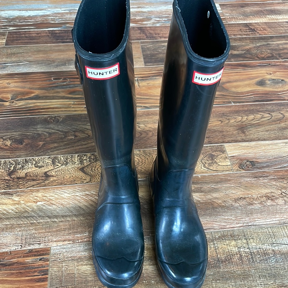 Tall black hunter boots